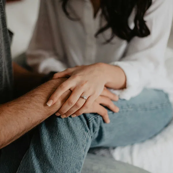 Couple holding hands representing intimacy and treatment for painful intercourse